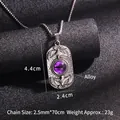 Collar colgante de ojo turco vintage con relieve de águila sobre fondo negro texturizado - Ojo Morado Con Cadena de Acero