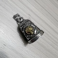 Macro shot of stainless steel biker guardian bell with gold skull and relief engraving - Dual-Color Single Bell