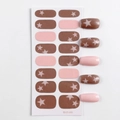 Nagelstickers met sterrenpatroon in bruin en roze met een glanzende afwerking - 16 Tips