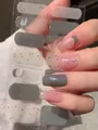 Detail of ultra-thin gel nail stickers in solid dark grey and pink spotted patterns - Dark Grey Translucent Pink Dots Style (PDD-213)