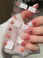 Detail of French white blush nail wraps featuring orange cartoon motifs on clear base - French White Edge Orange Cartoon Character Style (PDD-221)