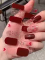 Detail view of dark red and heart pattern press-on nails with glitter finish - Dark Red Pink Colorful Glitter Style (PDD-234)