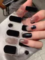 Detail of black and marble art press-on nails with silver foil accents on hand - Black White Ink Brown Silver Foil Style (PDD-235)