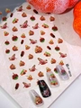 Macro detail of Halloween nail stickers with pumpkins and candies on marble surface - Halloween Pumpkin Brain Style (JY-0010)