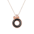 Elegant rose gold bow necklace featuring black ceramic rings with pavé set crystals - Rose Gold Black Ceramic