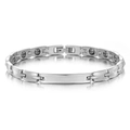 Macro detail of polished stainless steel bracelet featuring black magnetic therapy inserts - Steel Color