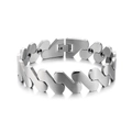 Macro detail of men's brushed stainless steel magnetic therapy bracelet with buckle engraving - Male Style