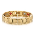 Macro detail of men's gold magnetic therapy bracelet with inset health stones - Gold Style