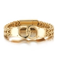 Bracciale manetta in acciaio inossidabile dorato con catena spiga spessa su sfondo bianco - Stile Oro