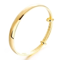 Polished 18K gold plated adjustable bangle with traditional relief interior patterns - Gold