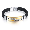 Detail of stainless steel clasp with Greek meander pattern and matte silicone strap - Gold