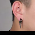 Detail of a minimalist black triangle ear clip for non-pierced ears on a male model - Triangle Clip (Non-Pierced) (Black)