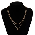 Detail of gold double-layered necklace featuring a cuban link chain and spiked cone pendant - Gold Spike Pendant Style (04658)
