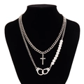 Men's punk necklace with cross pendant, pearls, and freedom handcuffs charm on black mannequin - Silver (06153)