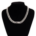 Close-up of iced out silver Cuban link chain with sparkling stones on black display stand - Silver (45cm)