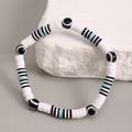 Pulsera bohemia para hombre con cuentas Heishi blancas y negras y amuleto de ojo turco - Estilo Multicolor 1