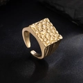 Detailed view of square men's ring with hammered metal texture and adjustable band - Gold 00903