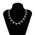 Men's silver alloy shark tooth necklace displayed on a black neck bust stand - Necklace / Antique Silver