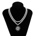 Double layered silver beaded necklace featuring a vintage sunburst flower pendant charm - Silver (06377)