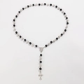 Religious rosary necklace featuring black and silver crystal beads with a metal cross - White + Black