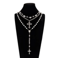Silver multi-layer necklace set with cross pendant and white pearls on black bust - Silver