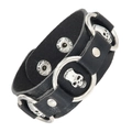 Punk black leather bracelet featuring silver metal skulls and snap buttons on white background - Black