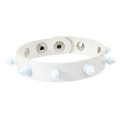 Close-up of a punk white spiked leather bracelet featuring silver metal snap buttons - White Leather + White Alloy Rivets