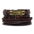 Close-up of vintage multi-layer braided leather bracelet with engraved cross metal plate - Antique Bronze Carved Cross Style