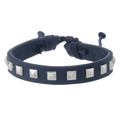 Detail of adjustable blue leather bracelet featuring silver square studs and knotted closure - Navy Blue