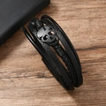Men's punk multi-layer black leather bracelet featuring a metal skull on wood surface - Leather Bracelet / Black