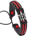 Detail of handmade black woven leather bracelet with red cords and silver turtle charm - Red Turtle