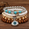 Böhmisches mehrlagiges Perlenarmband-Set mit Türkisperlen und Evil Eye Anhänger - Pfotenabdruck Polymer Ton Stil