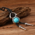 Vintage western bolo tie with turquoise pendant on a rustic wood background - Retro Round Sun Pattern Style (RH667-2)