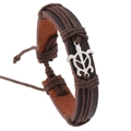 Detail of woven leather bracelet with silver turtle charm and adjustable cord knot - Brown Turtle