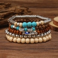 Detail von mehrlagigen Boho-Armbändern mit Türkisperlen und Evil-Eye-Anhänger - Lebensbaum Hamsa Hand Silber Stil