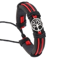 Close-up of hand-woven black leather bracelet with red stitching and Tree of Life charm - Red Tree of Life