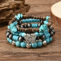 Böhmisches Mehrschicht-Armband-Set mit Türkisperlen, Holzperlen und einem Schmetterlingsanhänger - Himmelblauer Schmetterling Holzperlen Stil (1)