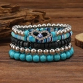 Detail view of five-piece multilayer beaded bracelet set with turquoise and evil eye charm - Heart Evil Eye Blue and White Style