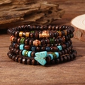 Boho Mehrlagiges Holzperlen Armband Set mit Türkis Schmetterling Anhänger und Sonnenmotiven - Vintage Sonnen Textur Holzperlen Stil (2)
