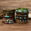 Bohemian multilayered wood and turquoise beaded bracelets with evil eye and butterfly charms - Mixed Color Wood Bead Style