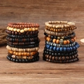 Set van 22 vintage meerlagige houten kralenarmbanden met schedelhanger in boho-etnische stijl - Gemengde Houten Kralen Armbandenset (22 Stuks)