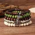 Detail von böhmischen vierlagigen Holzperlenarmbändern mit Silberblatt und Schmetterling - Wald Blatt Schmetterling Holzperlen Stil (4)