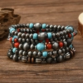 Macro view of multi-layer turquoise bead bracelets with silver accents on rustic wood - Vintage Metal Red Beads Style (5)