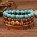 Detail of bohemian turquoise and wood bead bracelets set with silver crystal spacers - Multilayer Wood Turquoise Rhinestone Style