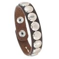 Detail of dark brown leather punk bracelet with round silver rivets and adjustable snaps - Coffee