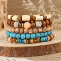 Macro view of bohemian multilayer bracelet set with wood beads and turquoise stones - Retro Engraved Tube Bead Style (6)