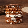 Détail de bracelets bohèmes superposés avec perles, coquillages et étoiles de mer - Ensemble Étoile de Mer + Coquillage