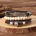 Bracciale multistrato vintage in pelle con perline di legno e ciondoli a piuma - Multicolore