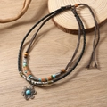 Detail of bohemian layered necklace with turquoise beads and vintage floral pendant - Flower Pendant Style (Style 1)
