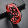 Close-up of red and black leather woven bracelet with infinity symbol and magnetic clasp - Red